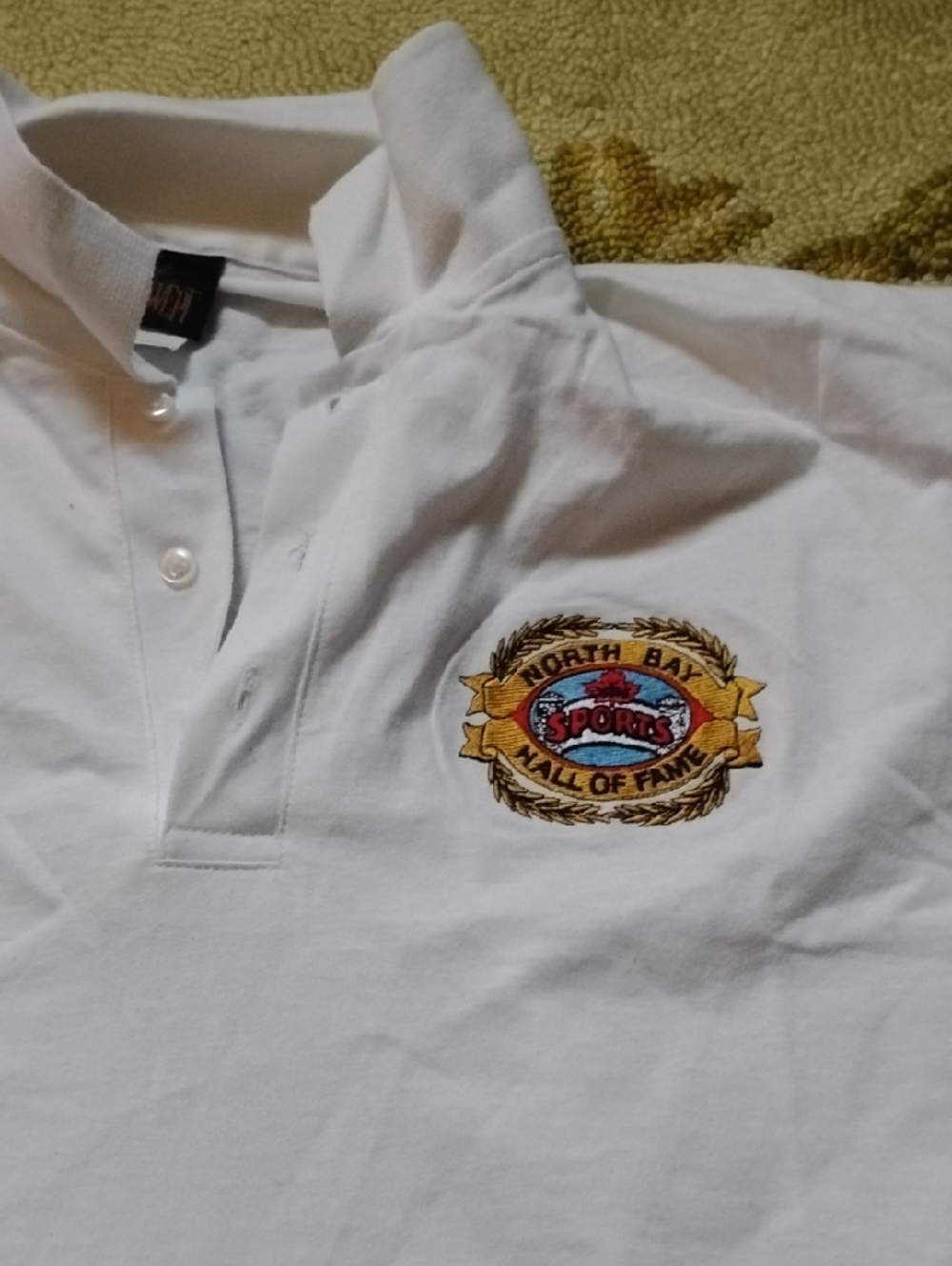 White Men's Polo with Embroidered Sports Crest